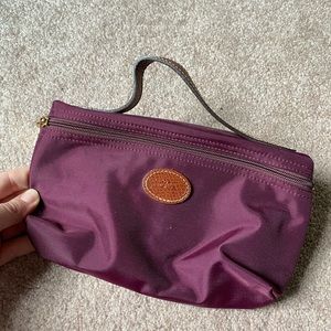 Longchamp makeup pouch.
